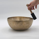 playing solfeggio sacral chakra tibetan singing bowl